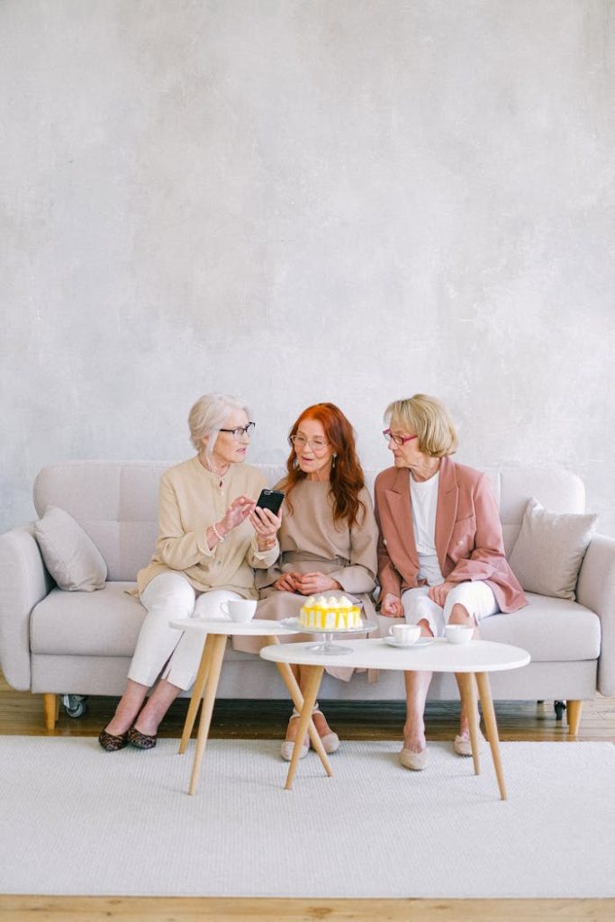 Women Sitting on Grey Sofa