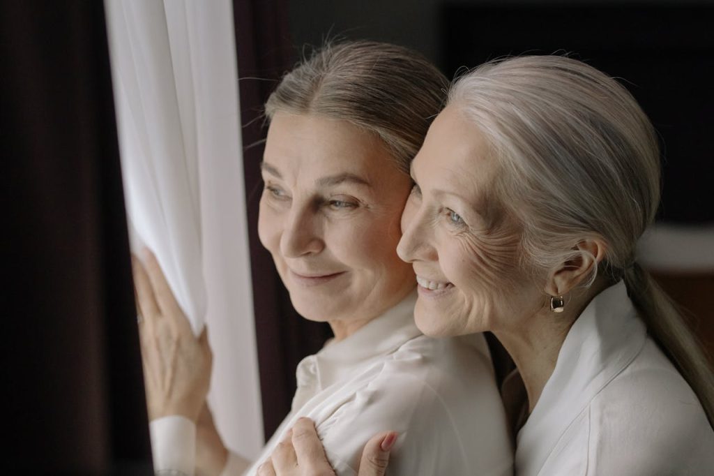 Elderly Women Looking Outside Together